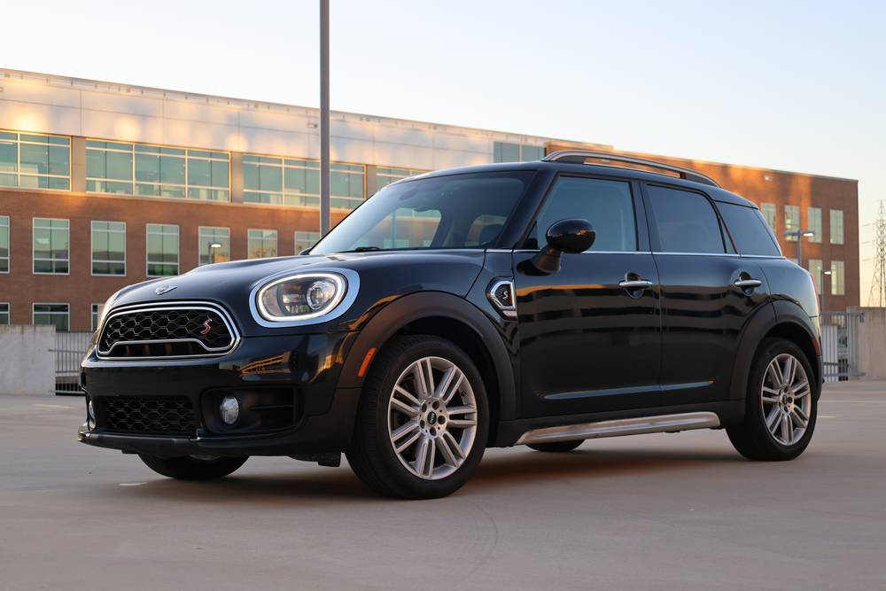 Black MINI Cooper Countryman parked at sunset