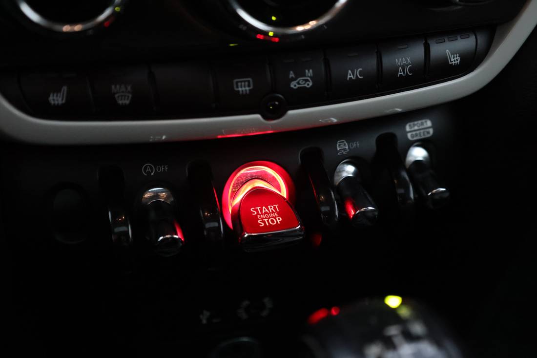 Illuminated engine start button on a MINI Cooper dashboard